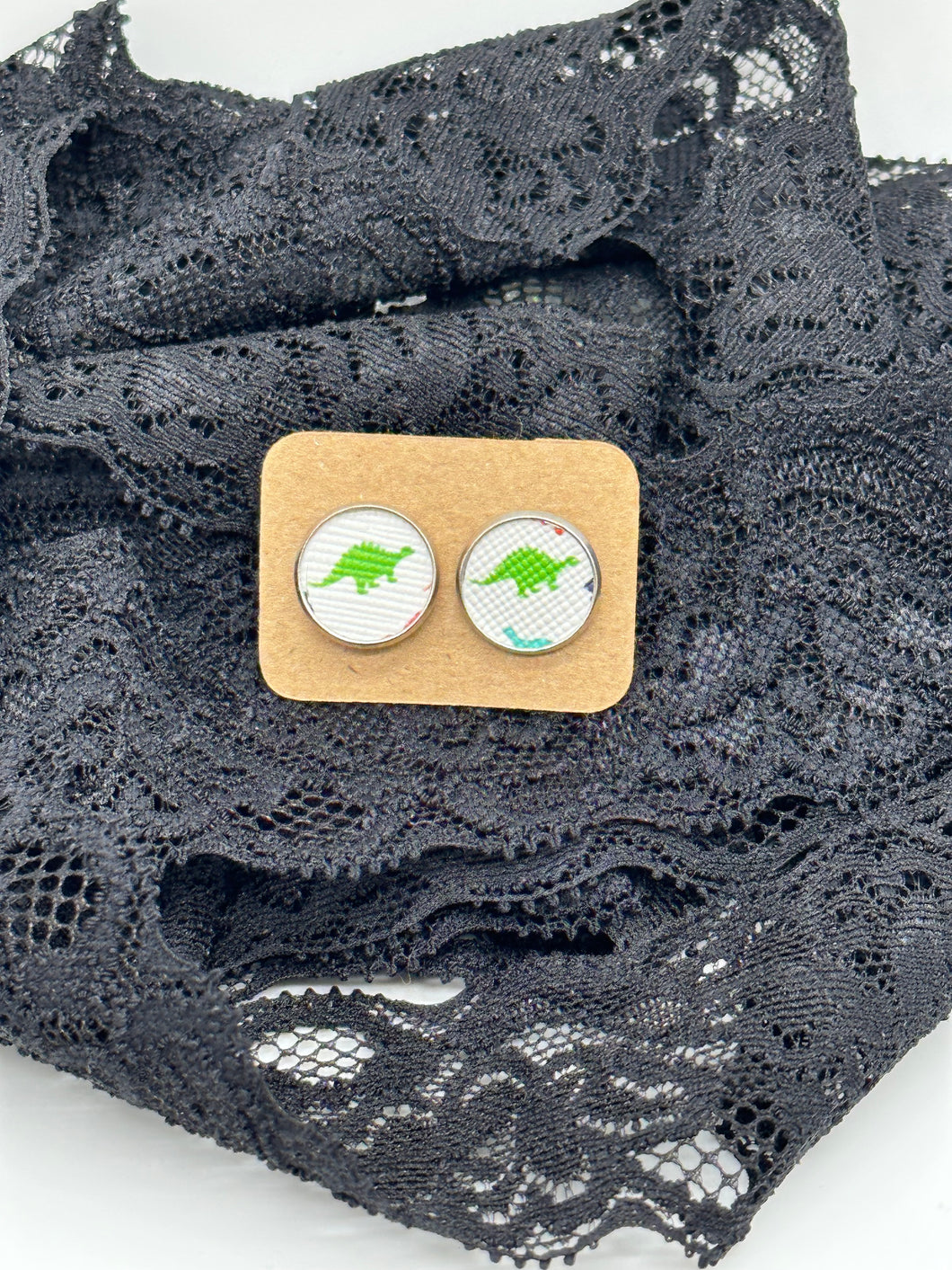 Green dinosaur faux leather stud earrings