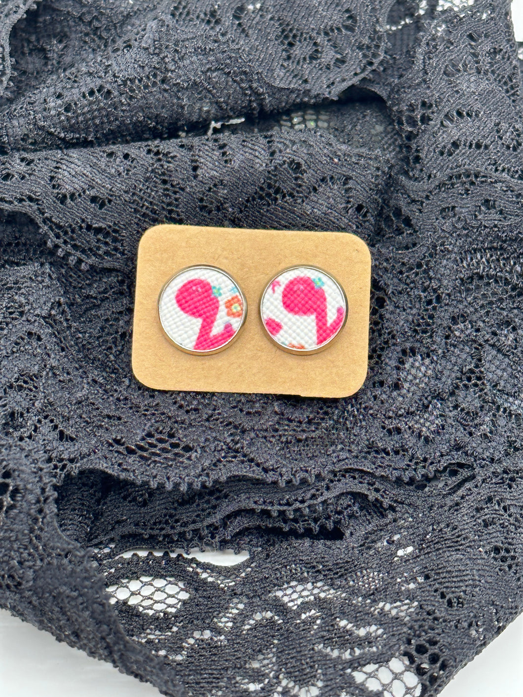 Pink dinosaur faux leather stud earrings