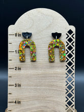 Load image into Gallery viewer, Gold glitter and black arched resin earrings
